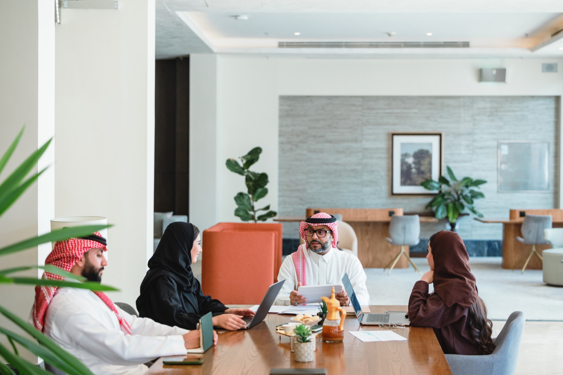 Saudi executives in boardroom review during a finance transformation engagement